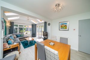 Dining room opens to Garden/Family Room- click for photo gallery